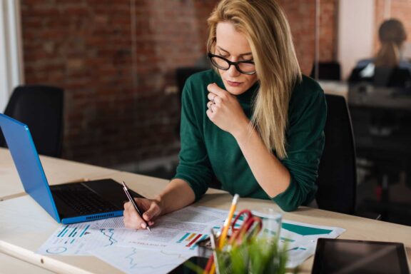 Business woman looking at reports