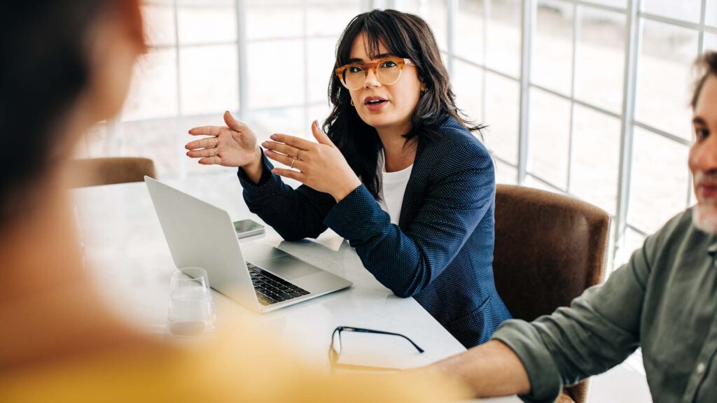 An employee in discussion with management at her company.