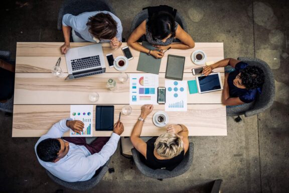 Group of professionals analyzing reports